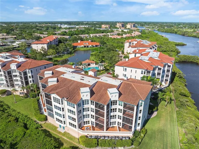an aerial view of residential building and lake view