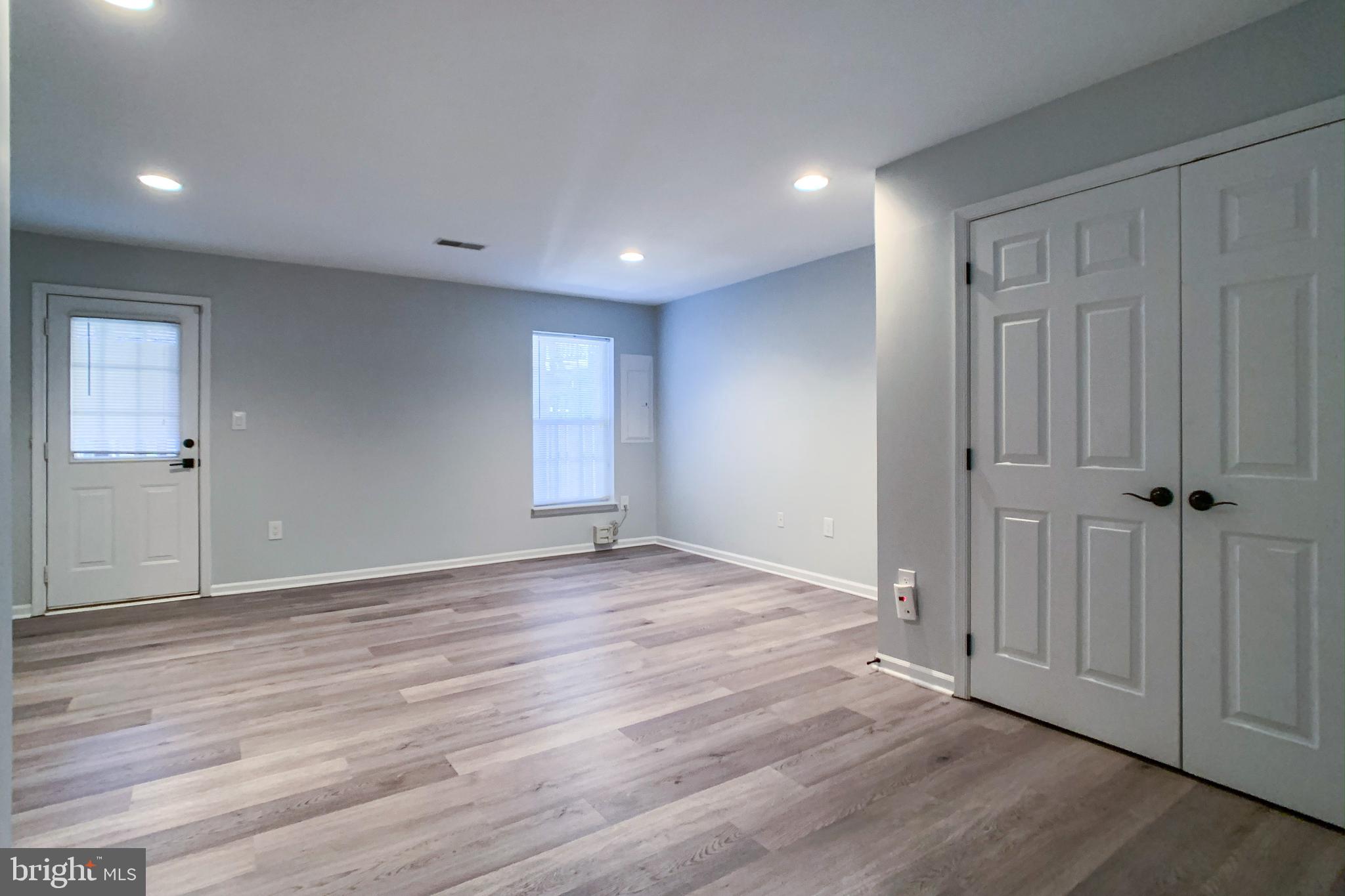 6988 Cromarty Drive Alexandria, VA 22315 - Photo 12 of 62 a view of an empty room with wooden floor