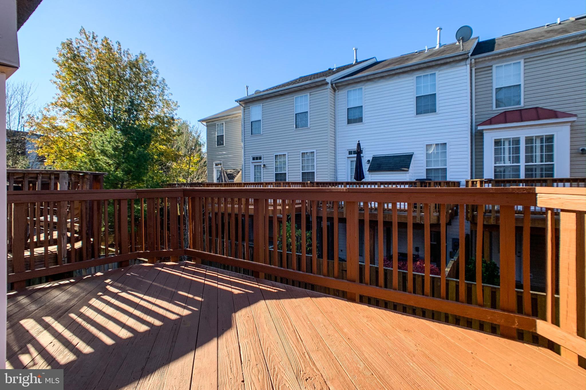 6988 Cromarty Drive Alexandria, VA 22315 - Photo 4 of 62 a view of a house with a wooden fence
