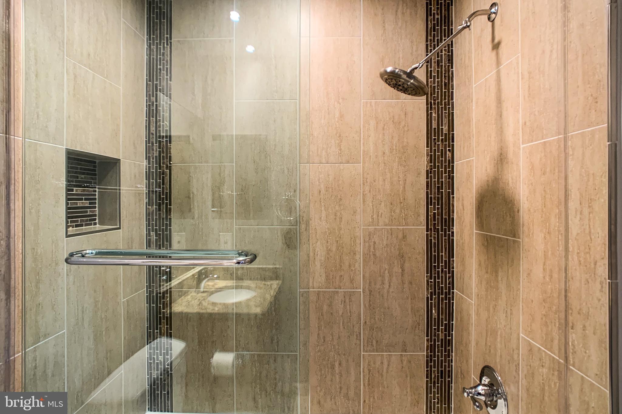 6988 Cromarty Drive Alexandria, VA 22315 - Photo 51 of 62 a bathroom with a shower