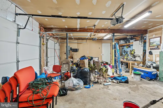 a view of chairs and wooden table in a room