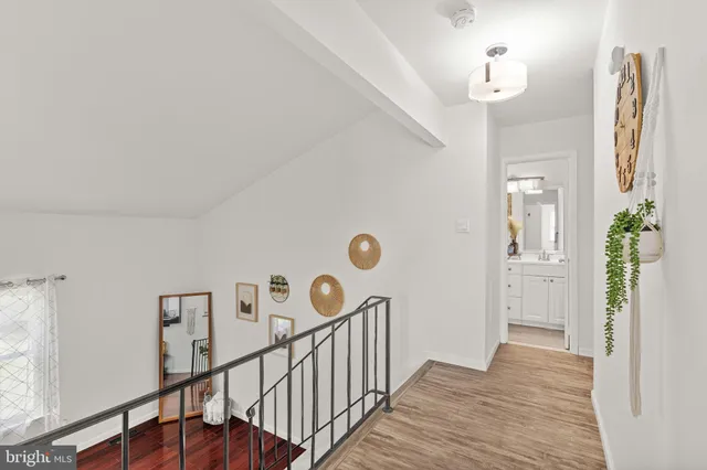 a bathroom with a sink toilet and a mirror