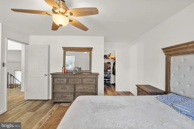 a bathroom with a sink mirror vanity and toilet
