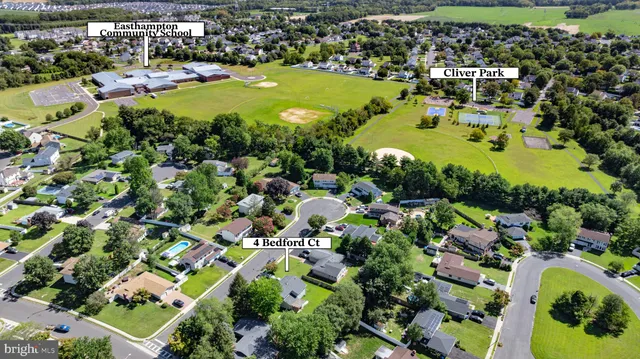 an aerial view of a house with a swimming pool yard and outdoor seating