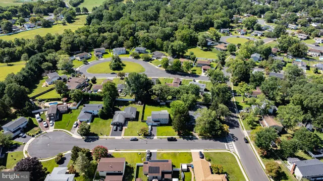 an aerial view of a house with a swimming pool yard and outdoor seating