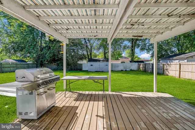 a view of a backyard with sitting area and furniture