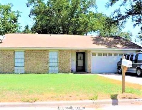 1220 Burt Street Bryan, TX 77803 - Photo 1 of 1 a front view of house with yard