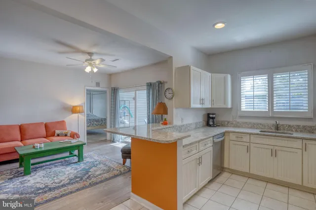a living room with furniture a chandelier and a couch