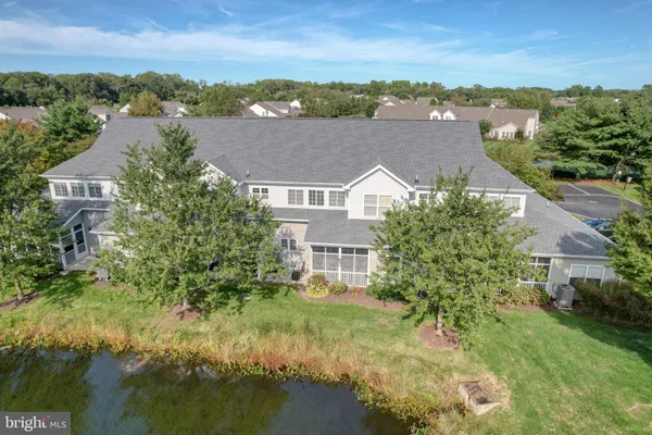 a kitchen with stainless steel appliances granite countertop a refrigerator and a stove