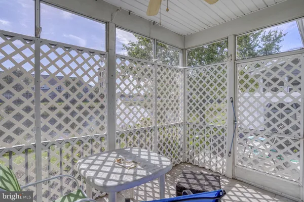 a view of a chair and table in the patio