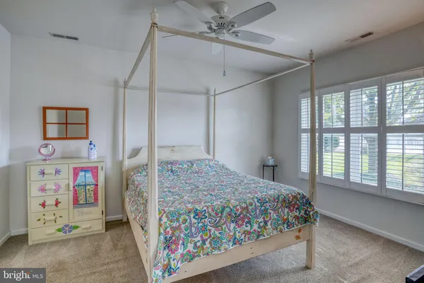 a view of a lake with houses in the back