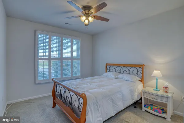 a bathroom with a shower sink and mirror