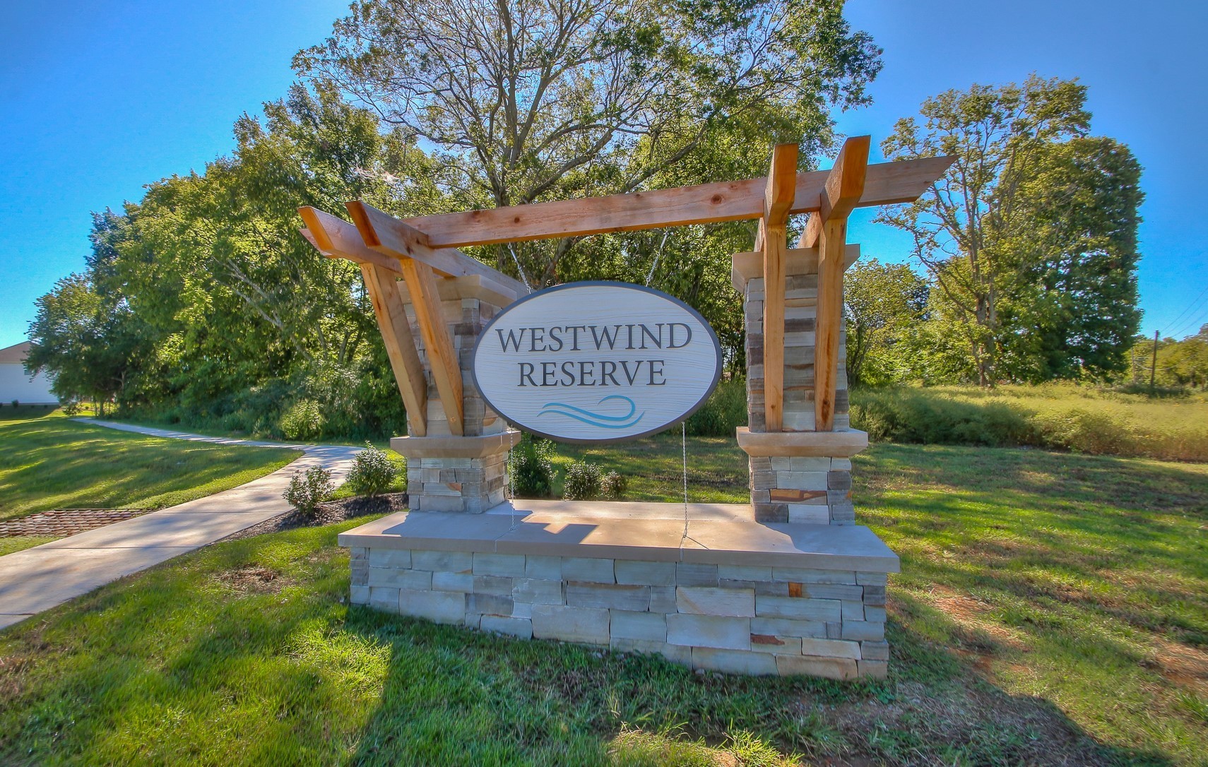 3741 Lantern Lane Murfreesboro, TN 37128 - Photo 13 of 19 a wooden bench sitting in the middle of a park