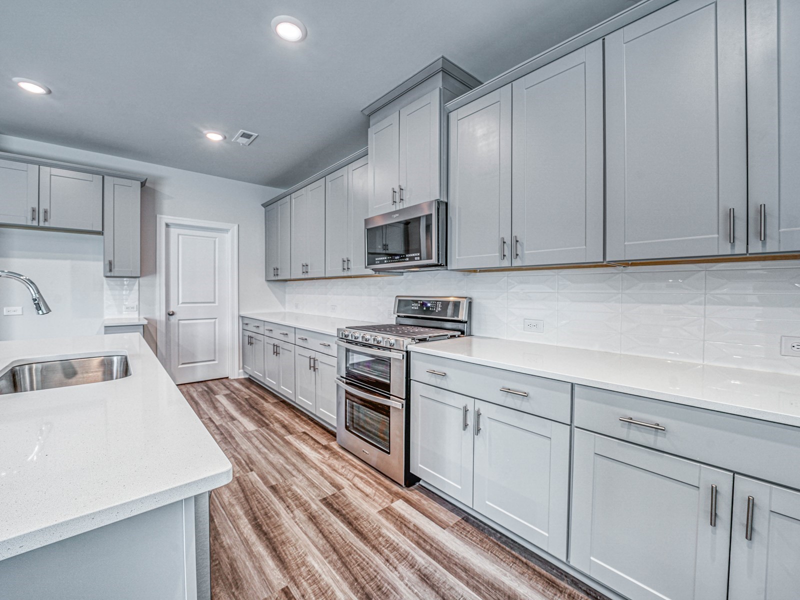 3741 Lantern Lane Murfreesboro, TN 37128 - Photo 6 of 19 a kitchen with white cabinets and stainless steel appliances
