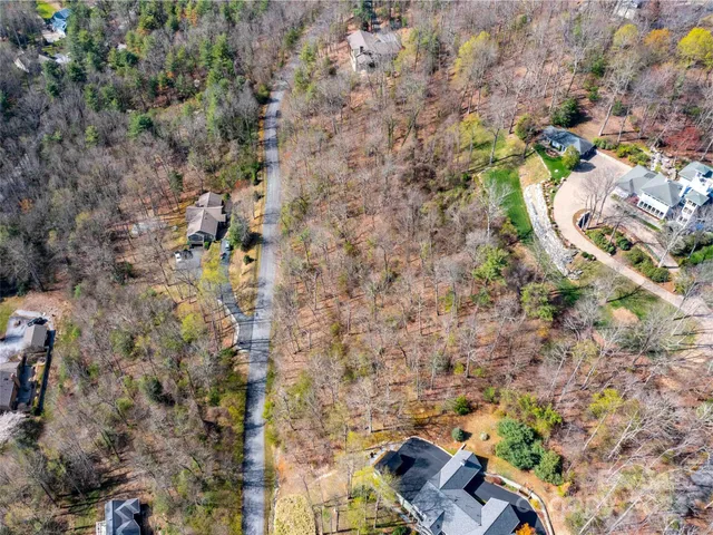 a aerial view of a house with a yard