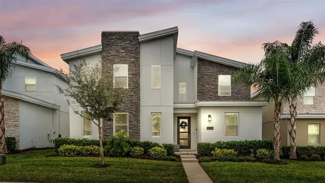 a front view of house with yard and green space