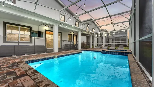 a kitchen with stainless steel appliances white cabinets and a stove