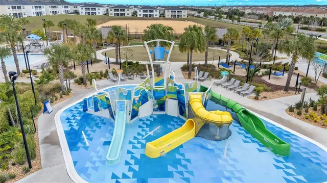 a bathroom with a granite countertop sink a toilet a mirror and shower