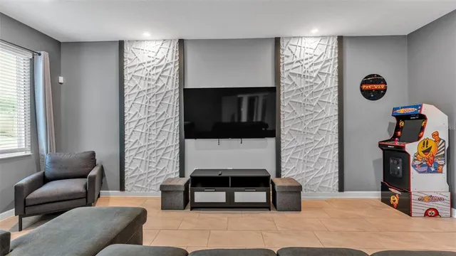 a front view of a house with a yard and potted plants