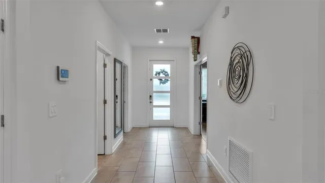 a bedroom with two beds and a mirror