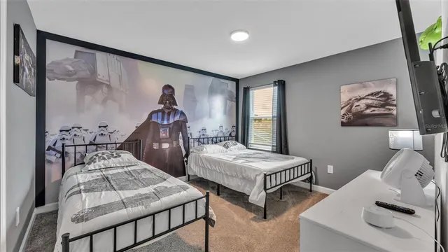 a dining room with furniture a chandelier and window