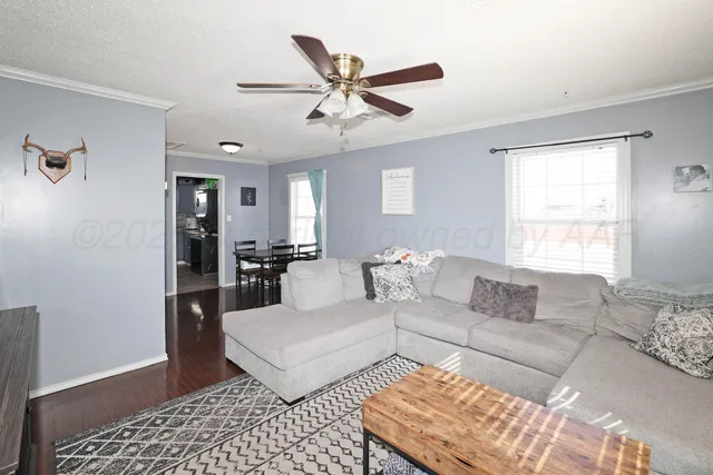 a living room with furniture and a window