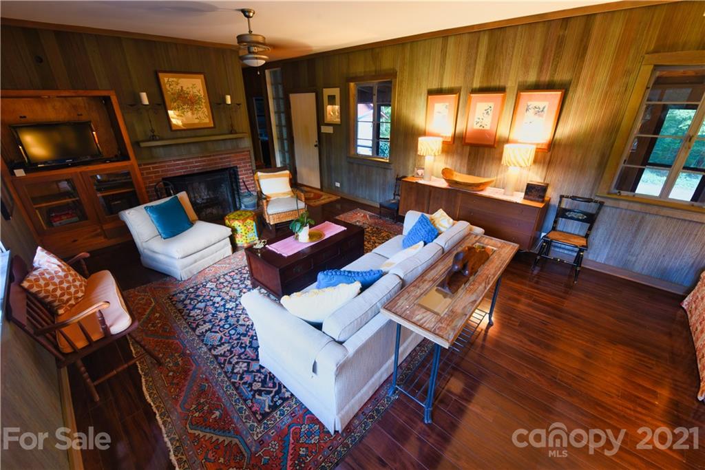 528 Wilderness Road Tryon, NC 28782 - Photo 12 of 29 a living room with furniture and a flat screen tv