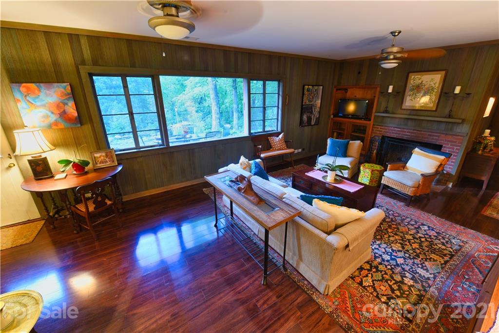 528 Wilderness Road Tryon, NC 28782 - Photo 14 of 29 a living room with furniture and a wooden floor