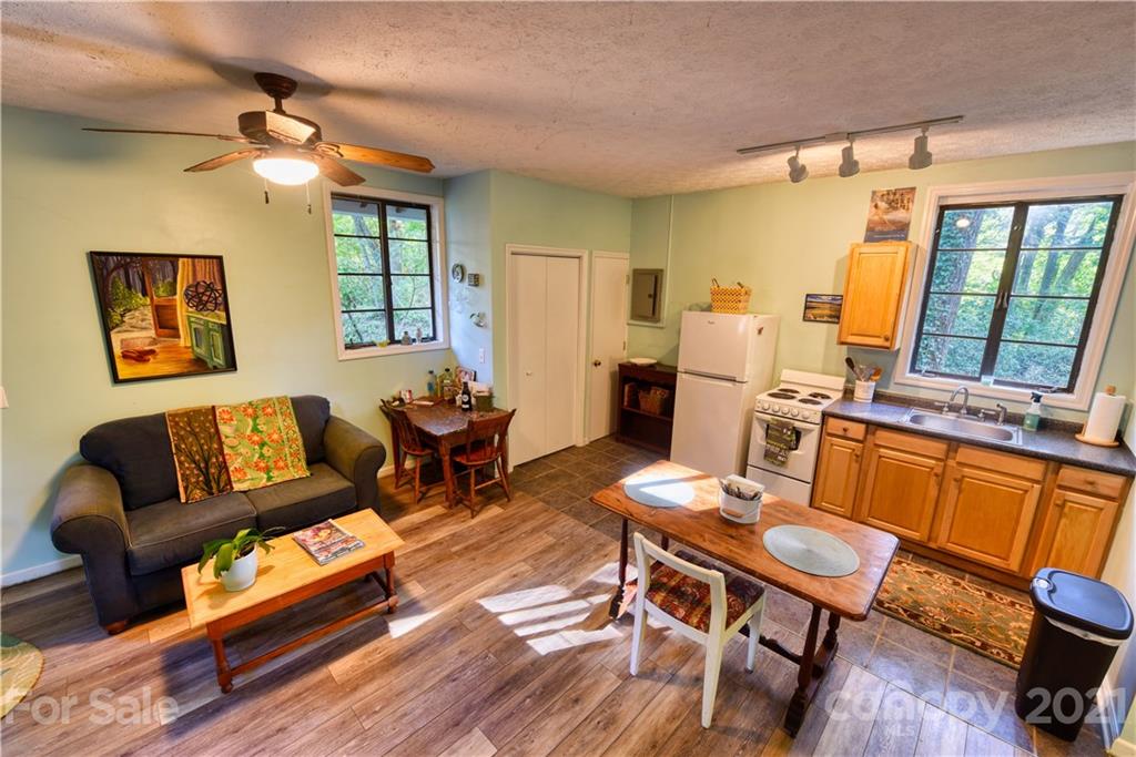 528 Wilderness Road Tryon, NC 28782 - Photo 24 of 29 a living room with furniture and a table