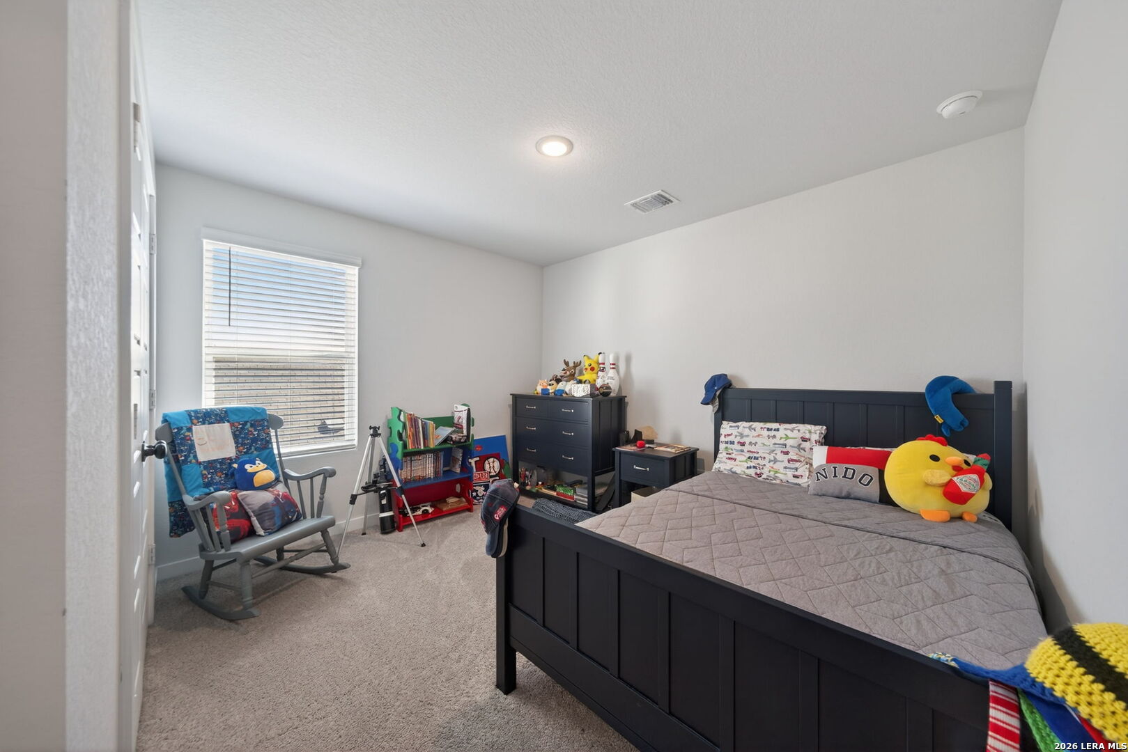 4238 Danforth Street New Braunfels, TX 78130 - Photo 14 of 21 a bedroom with a bed and wooden floor