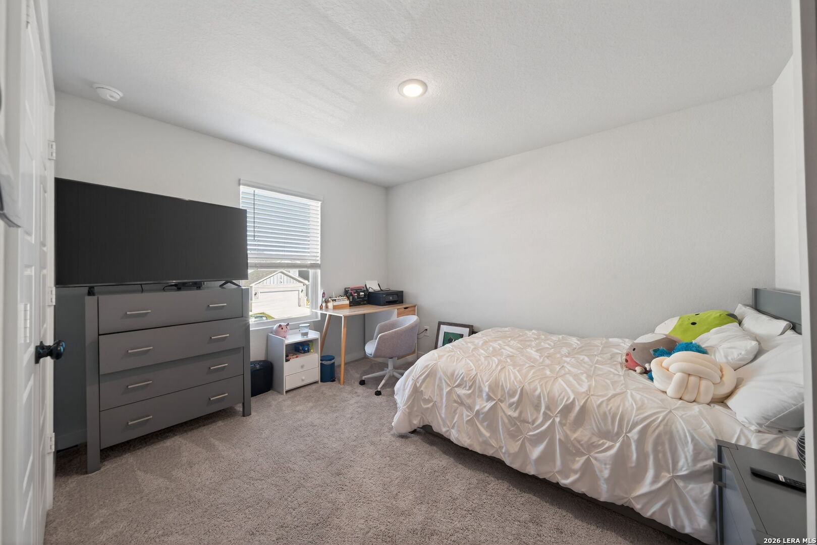 4238 Danforth Street New Braunfels, TX 78130 - Photo 15 of 21 a bedroom with a bed and flat screen tv