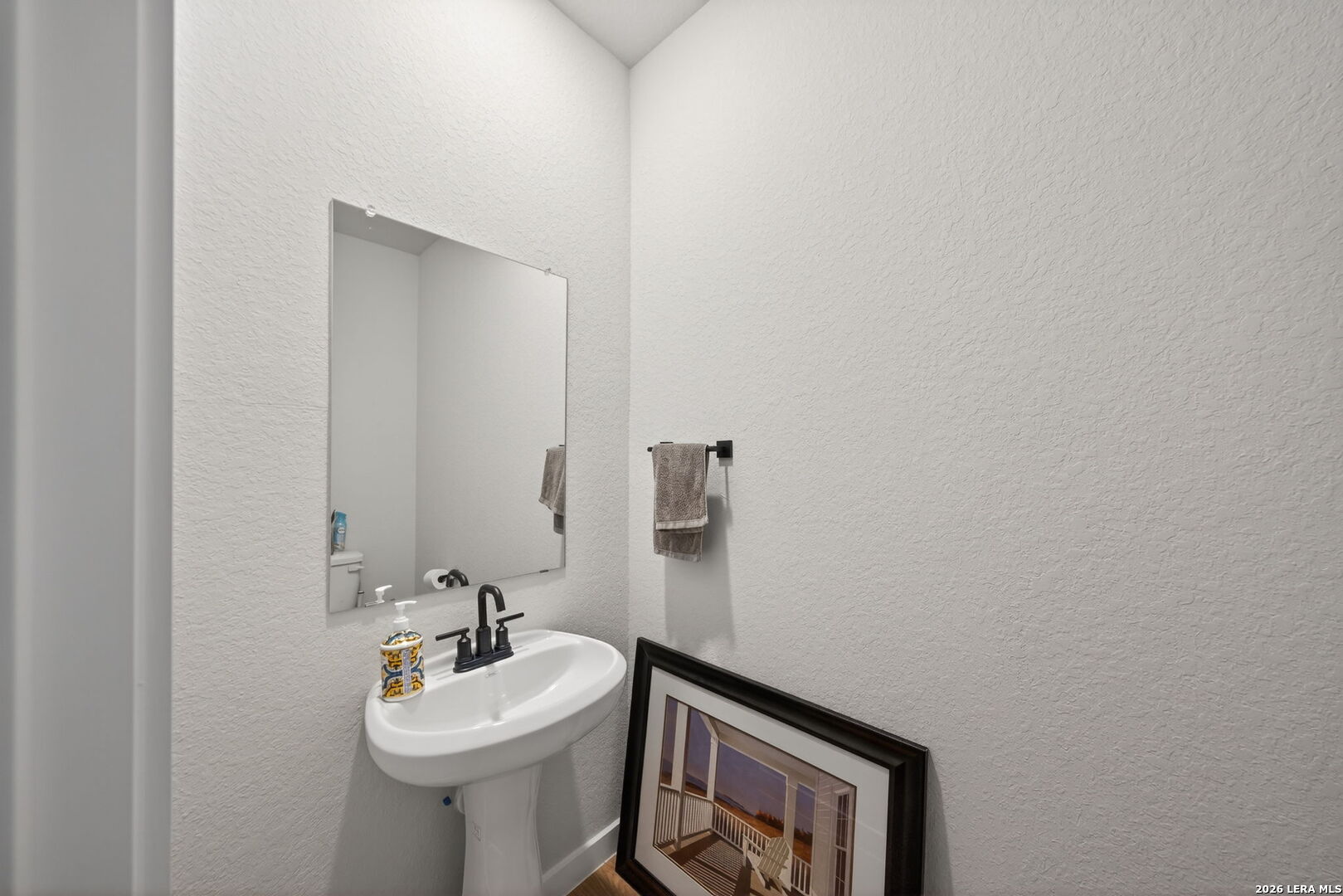 4238 Danforth Street New Braunfels, TX 78130 - Photo 17 of 21 a bathroom with a sink mirror and toilet