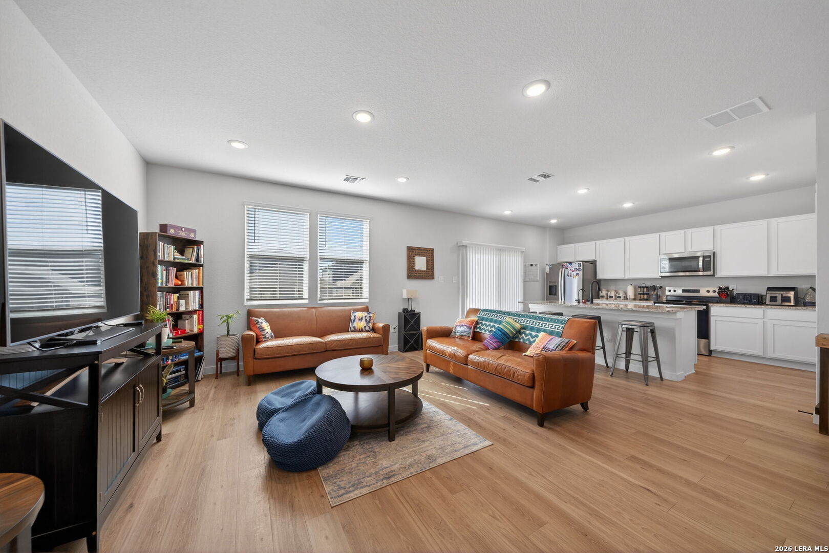 4238 Danforth Street New Braunfels, TX 78130 - Photo 2 of 21 a living room with furniture and a flat screen tv
