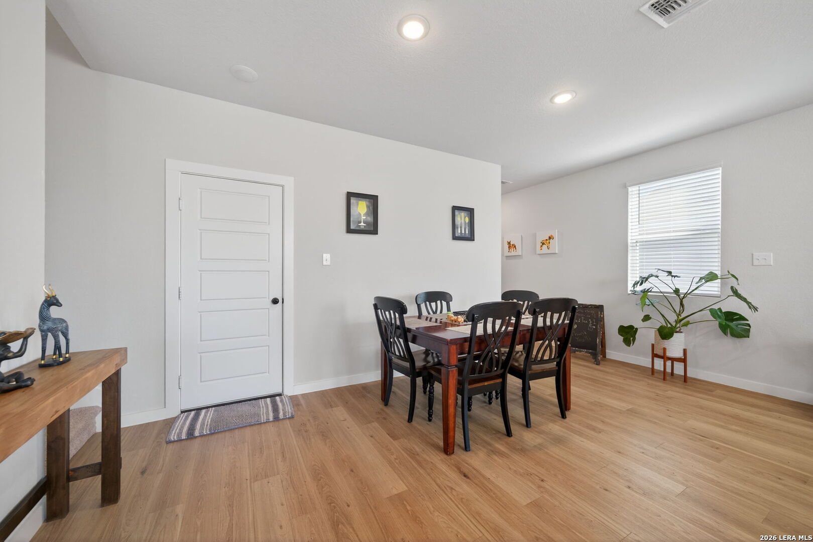 4238 Danforth Street New Braunfels, TX 78130 - Photo 5 of 21 a view of a dining room with furniture and wooden floor