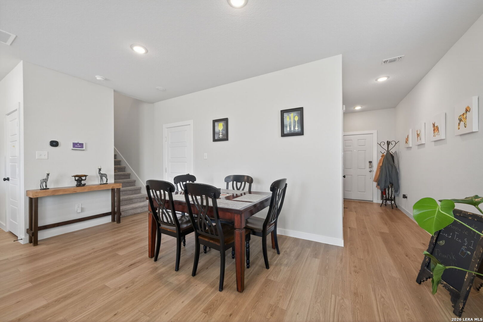 4238 Danforth Street New Braunfels, TX 78130 - Photo 6 of 21 a view of a dining room with furniture and wooden floor