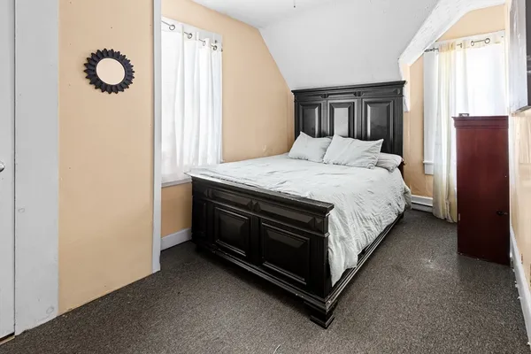 a bed room with a bed and a window