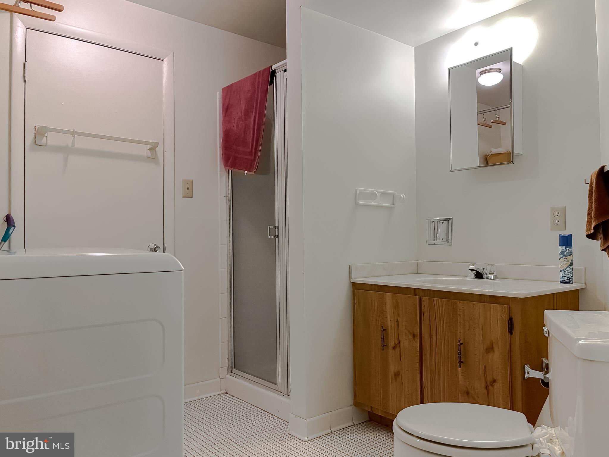 2422 Pinefield Road Waldorf, MD 20601 - Photo 36 of 43 a bathroom with a toilet a sink and shower