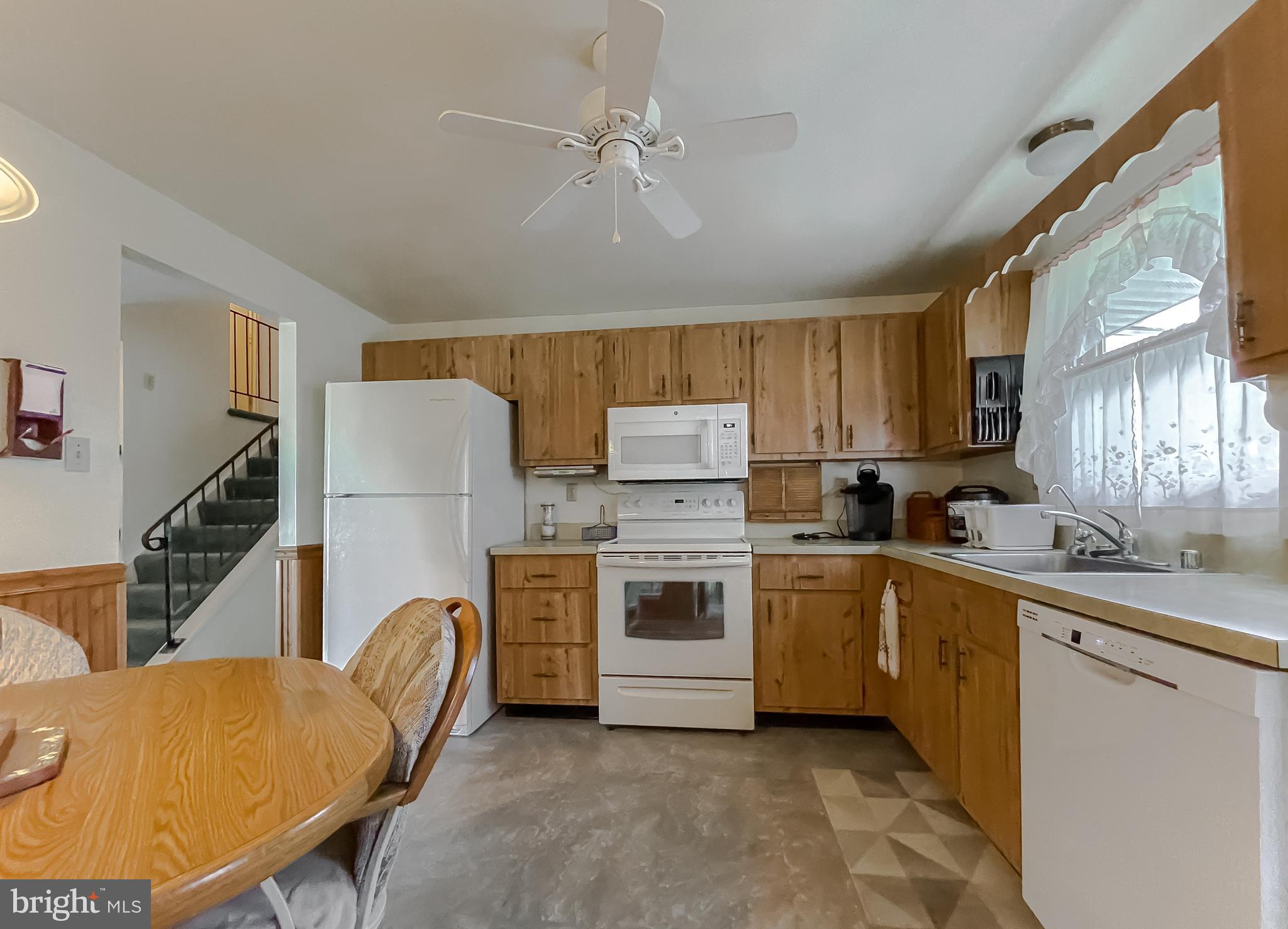 2422 Pinefield Road Waldorf, MD 20601 - Photo 9 of 43 a kitchen with a sink appliances and cabinets