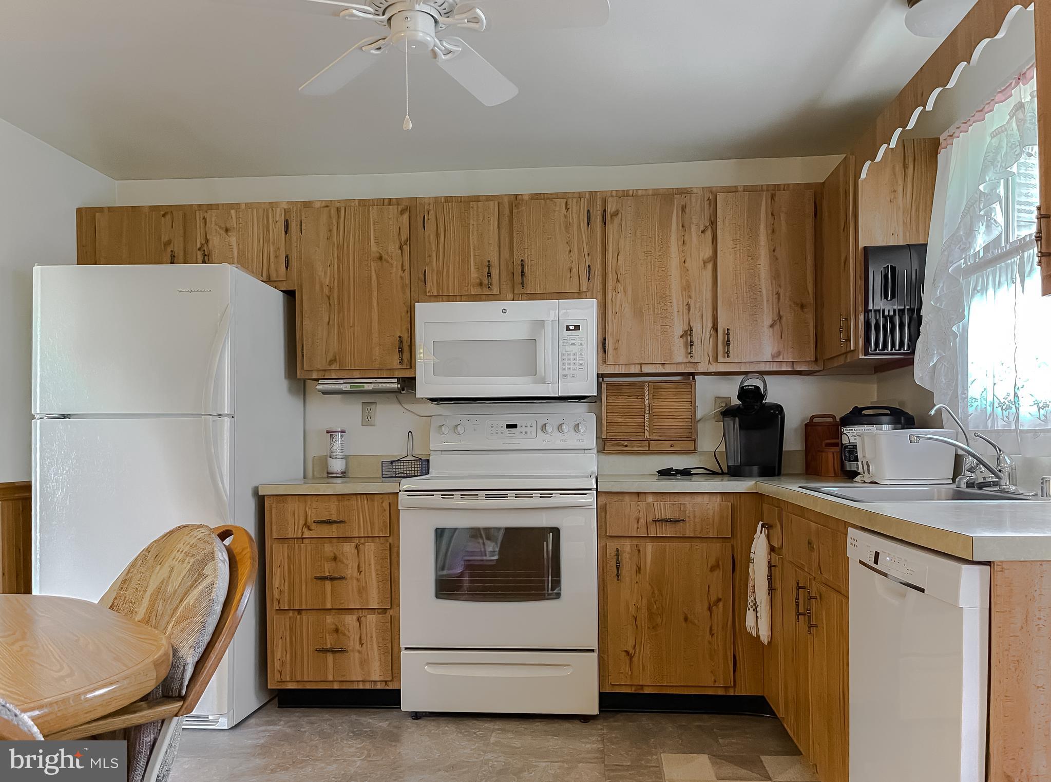 2422 Pinefield Road Waldorf, MD 20601 - Photo 10 of 43 a kitchen with cabinets appliances and a center island