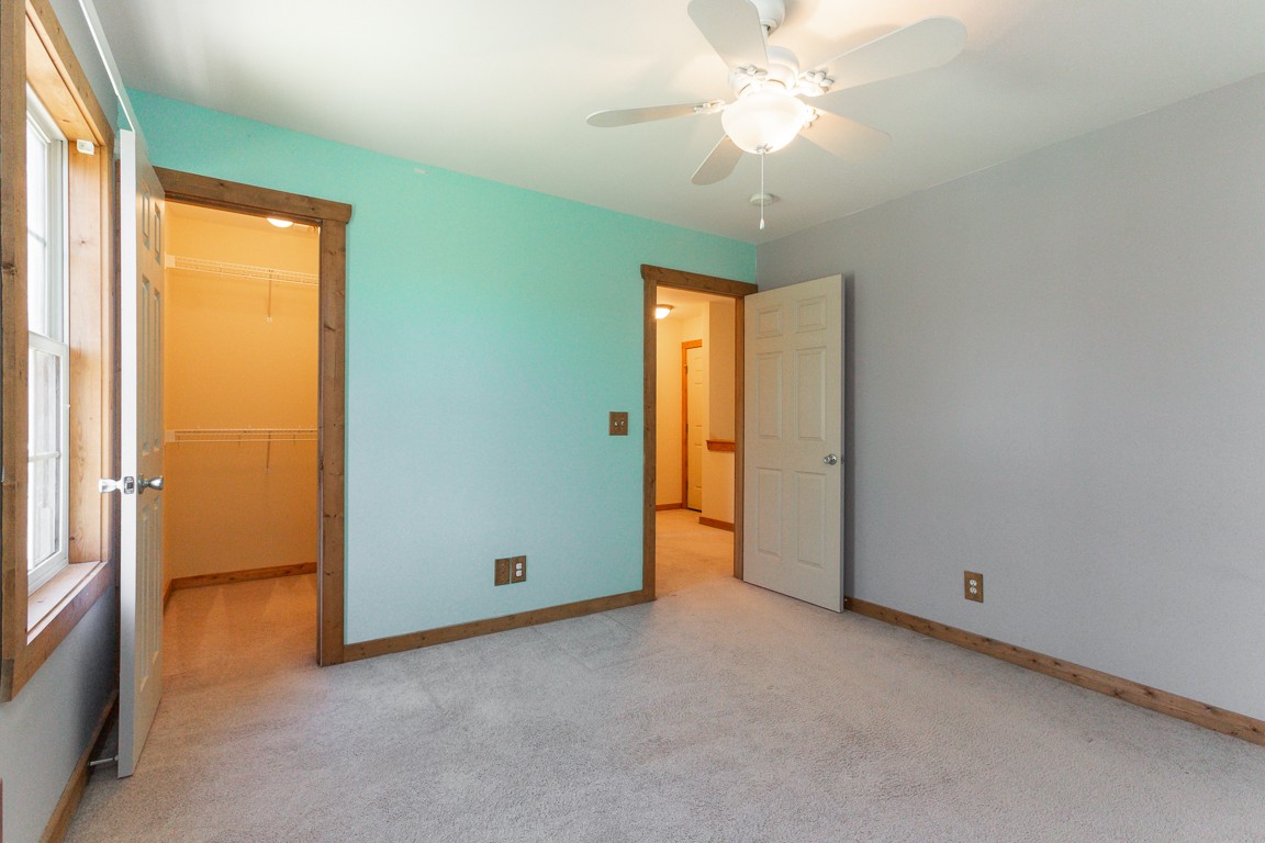 810 Pebble Cove Road Lebanon, TN 37087 - Photo 23 of 37 an empty room with closet and a chandelier fan