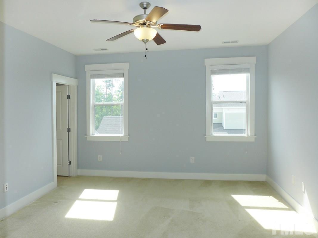 74 Owen Towne Road Chapel Hill, NC 27516 - Photo 11 of 27 a view of a livingroom with a ceiling fan and window
