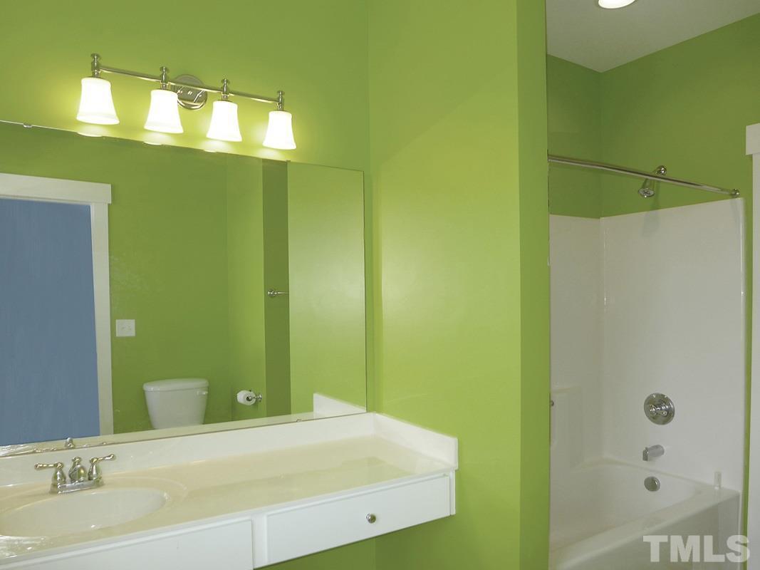 74 Owen Towne Road Chapel Hill, NC 27516 - Photo 15 of 27 a bathroom with a bathtub and a sink
