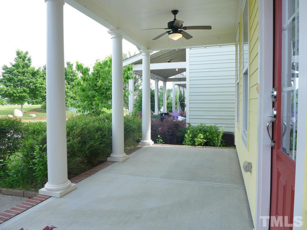74 Owen Towne Road Chapel Hill, NC 27516 - Photo 3 of 27 a porch with seating space and garden view