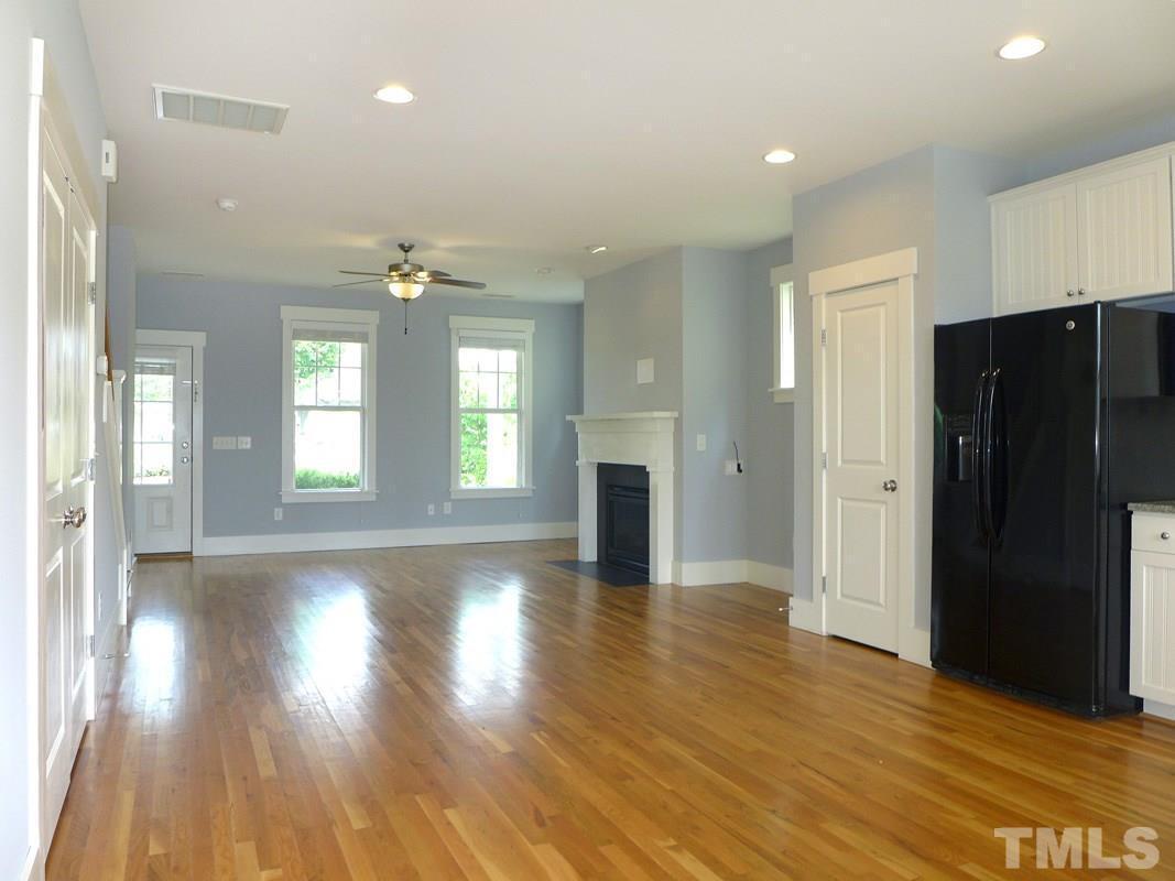 74 Owen Towne Road Chapel Hill, NC 27516 - Photo 5 of 27 a view of an empty room with wooden floor and a window