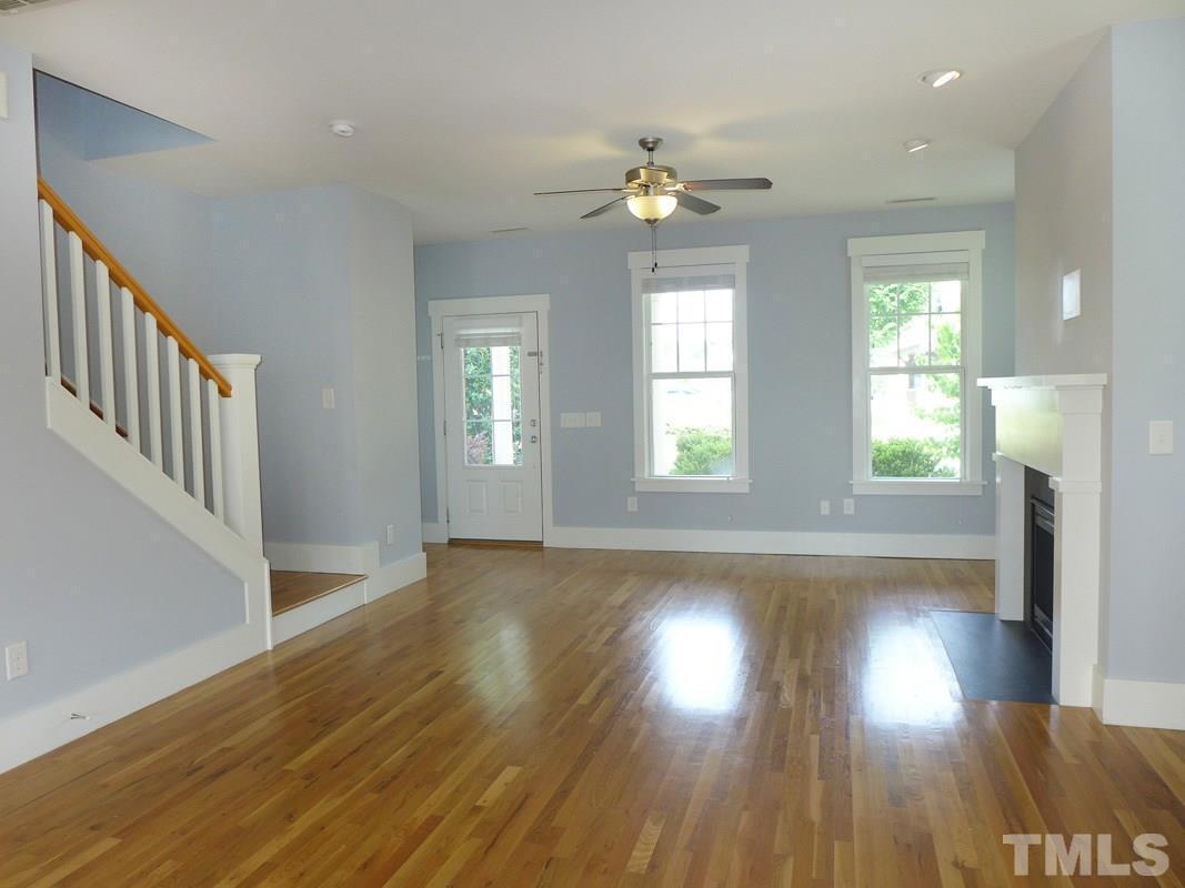 74 Owen Towne Road Chapel Hill, NC 27516 - Photo 7 of 27 a view of an empty room with wooden floor and a window