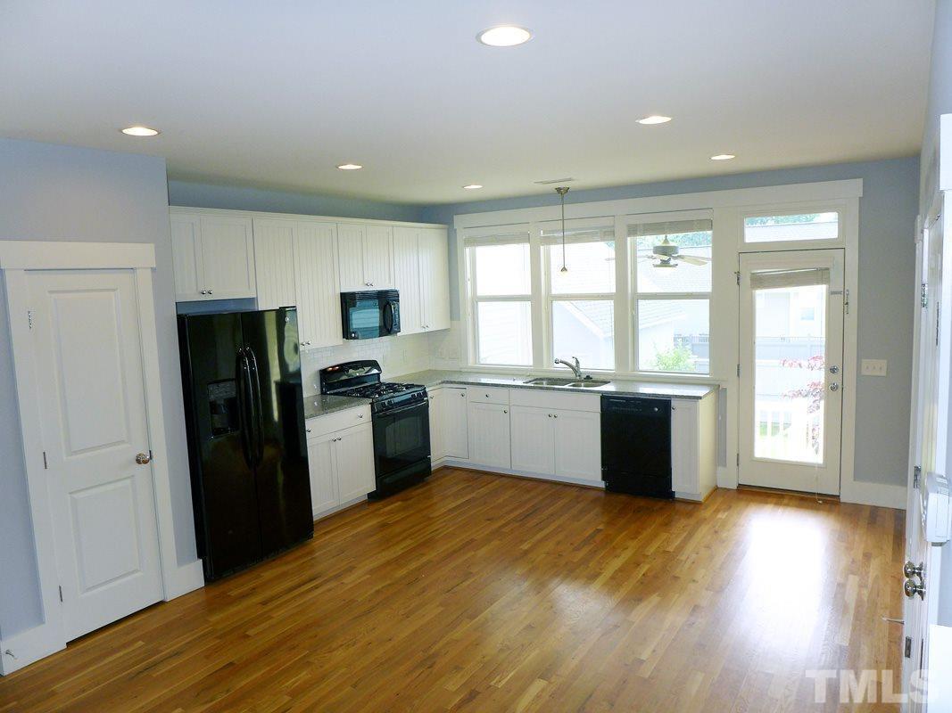 74 Owen Towne Road Chapel Hill, NC 27516 - Photo 8 of 27 a kitchen with a refrigerator and a stove top oven