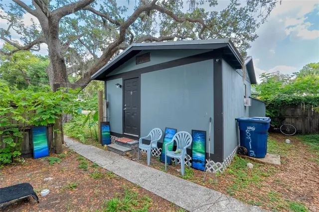 a backyard of a house with seating space