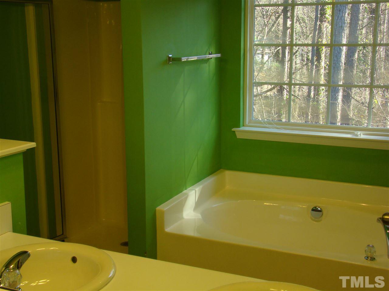 3102 Binghampton Lane Raleigh, NC 27604 - Photo 12 of 13 a bathroom with a bathtub