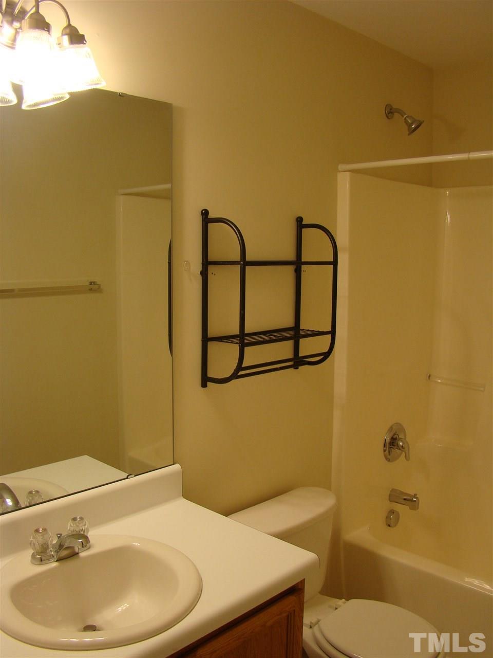 3102 Binghampton Lane Raleigh, NC 27604 - Photo 13 of 13 a bathroom with a sink a toilet and shower