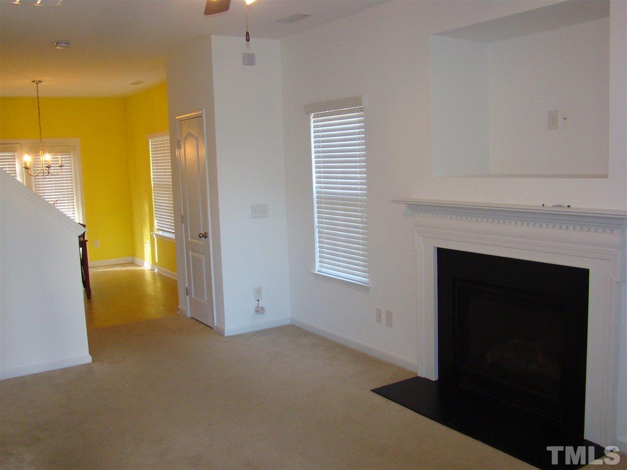 3102 Binghampton Lane Raleigh, NC 27604 - Photo 5 of 13 a view of empty room with a fireplace